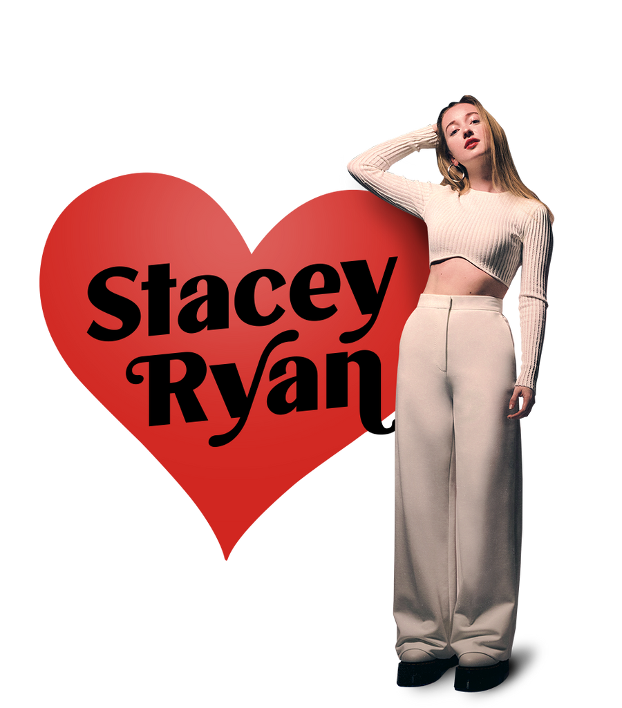 Stacey Ryan in a Cream outfit next to a huge red heart shape with her name inside.